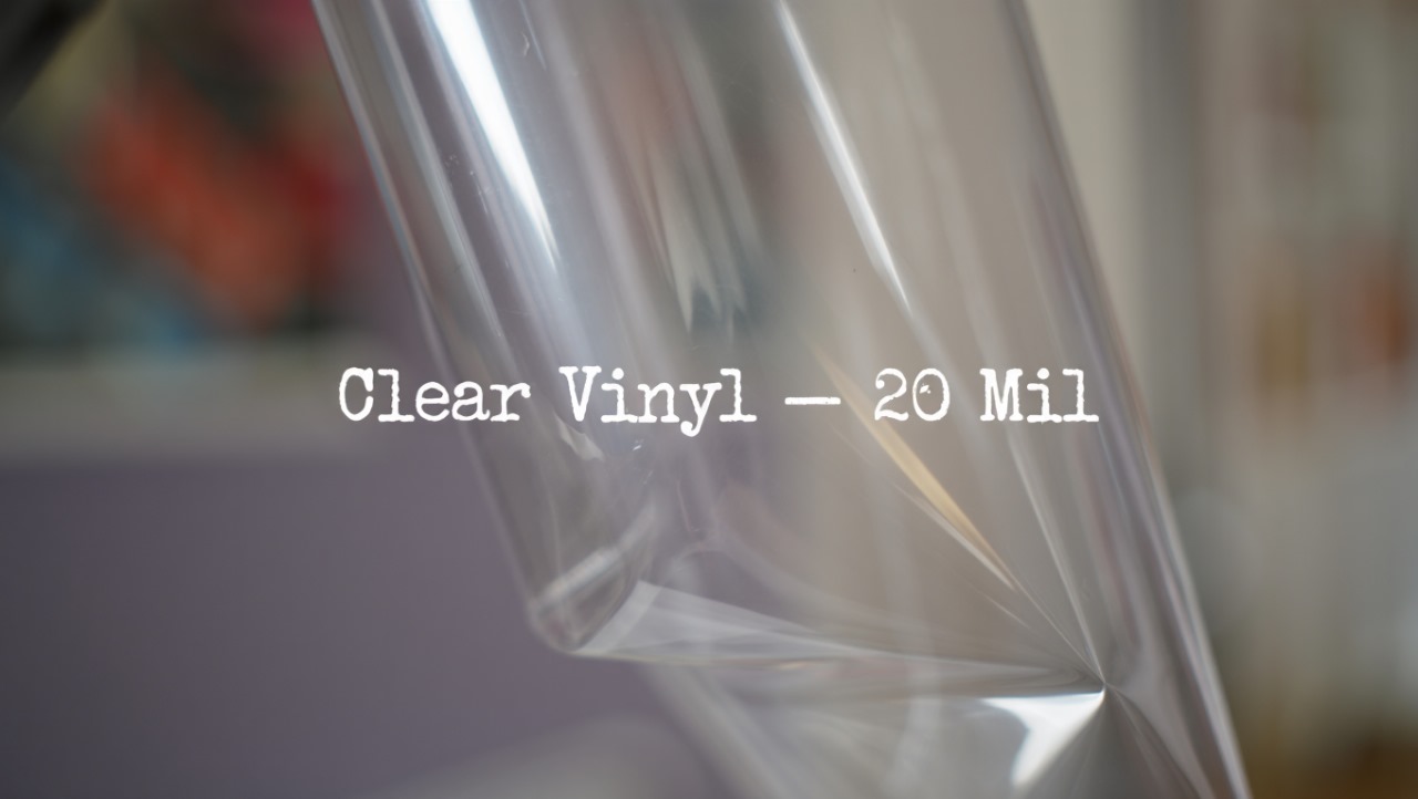 Transparent 20 mil clear vinyl sheet with glossy surface and visible light reflections.